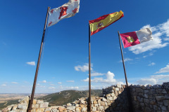 The flags of the Order of Calatrava, of Spain and Castilla La Mancha flying together
